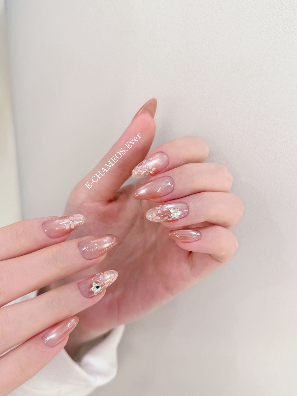 Sheer Pink Pearl Gel Nails with Floral Rhinestones